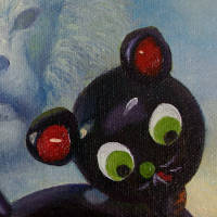 black wooden cat with white spots and red wheels with ghostly snarling lion in background